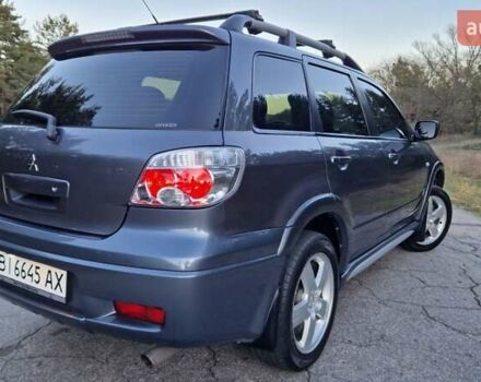 Серый Мицубиси Аутлендер, объемом двигателя 2 л и пробегом 157 тыс. км за 8300 $, фото 7 на Automoto.ua