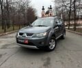 Серый Мицубиси Аутлендер, объемом двигателя 2.4 л и пробегом 237 тыс. км за 8490 $, фото 1 на Automoto.ua
