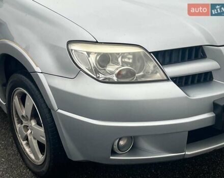 Серый Мицубиси Аутлендер, объемом двигателя 2.4 л и пробегом 324 тыс. км за 6890 $, фото 1 на Automoto.ua