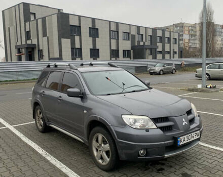 Серый Мицубиси Аутлендер, объемом двигателя 2.38 л и пробегом 227 тыс. км за 6600 $, фото 2 на Automoto.ua