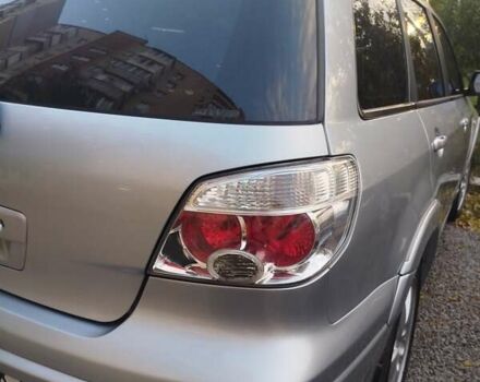 Сірий Міцубісі Аутлендер, об'ємом двигуна 2.38 л та пробігом 209 тис. км за 7460 $, фото 10 на Automoto.ua