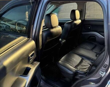 Серый Мицубиси Аутлендер, объемом двигателя 2.18 л и пробегом 287 тыс. км за 10200 $, фото 6 на Automoto.ua