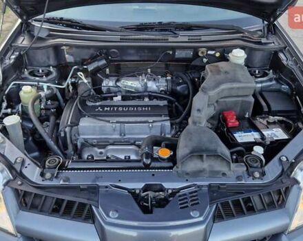 Серый Мицубиси Аутлендер, объемом двигателя 2 л и пробегом 157 тыс. км за 8300 $, фото 30 на Automoto.ua