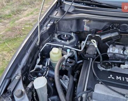 Серый Мицубиси Аутлендер, объемом двигателя 2 л и пробегом 157 тыс. км за 8300 $, фото 31 на Automoto.ua