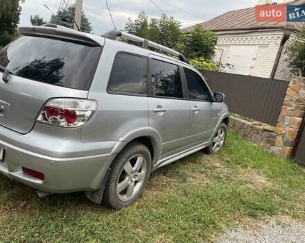 Сірий Міцубісі Аутлендер, об'ємом двигуна 2.38 л та пробігом 209 тис. км за 7460 $, фото 5 на Automoto.ua
