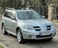 Серый Мицубиси Аутлендер, объемом двигателя 2.4 л и пробегом 170 тыс. км за 6900 $, фото 3 на Automoto.ua