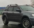 Серый Мицубиси Аутлендер, объемом двигателя 2 л и пробегом 200 тыс. км за 5999 $, фото 1 на Automoto.ua