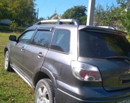 Серый Мицубиси Аутлендер, объемом двигателя 2.38 л и пробегом 117 тыс. км за 7900 $, фото 5 на Automoto.ua