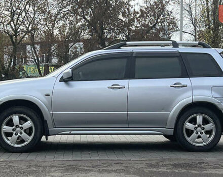 Серый Мицубиси Аутлендер, объемом двигателя 2.38 л и пробегом 197 тыс. км за 7699 $, фото 3 на Automoto.ua