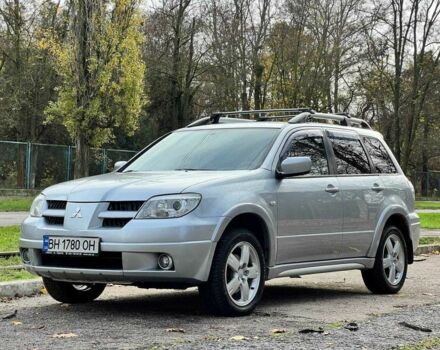 Серый Мицубиси Аутлендер, объемом двигателя 2.4 л и пробегом 170 тыс. км за 6900 $, фото 1 на Automoto.ua