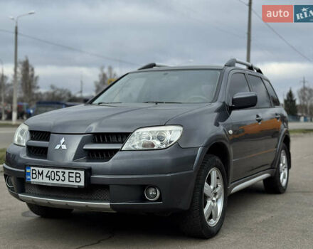 Серый Мицубиси Аутлендер, объемом двигателя 2.38 л и пробегом 254 тыс. км за 7300 $, фото 1 на Automoto.ua