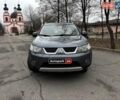 Серый Мицубиси Аутлендер, объемом двигателя 2.4 л и пробегом 237 тыс. км за 8490 $, фото 1 на Automoto.ua