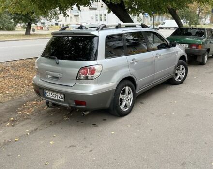 Серый Мицубиси Аутлендер, объемом двигателя 2 л и пробегом 237 тыс. км за 6000 $, фото 2 на Automoto.ua