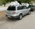 Серый Мицубиси Аутлендер, объемом двигателя 2 л и пробегом 237 тыс. км за 6000 $, фото 2 на Automoto.ua