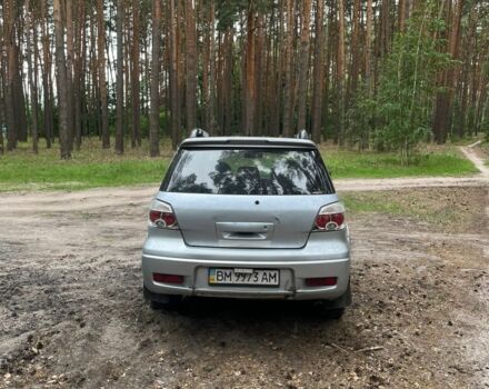 Серый Мицубиси Аутлендер, объемом двигателя 2.4 л и пробегом 225 тыс. км за 6500 $, фото 2 на Automoto.ua
