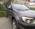 Серый Мицубиси Аутлендер, объемом двигателя 2.38 л и пробегом 160 тыс. км за 8300 $, фото 4 на Automoto.ua