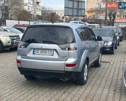 Серый Мицубиси Аутлендер, объемом двигателя 2.36 л и пробегом 237 тыс. км за 8900 $, фото 3 на Automoto.ua