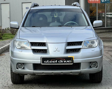 Серый Мицубиси Аутлендер, объемом двигателя 2.38 л и пробегом 197 тыс. км за 7699 $, фото 1 на Automoto.ua