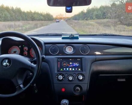 Серый Мицубиси Аутлендер, объемом двигателя 2 л и пробегом 157 тыс. км за 8300 $, фото 20 на Automoto.ua