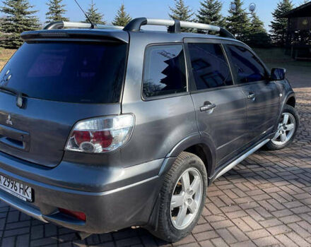 Серый Мицубиси Аутлендер, объемом двигателя 2 л и пробегом 250 тыс. км за 5400 $, фото 5 на Automoto.ua