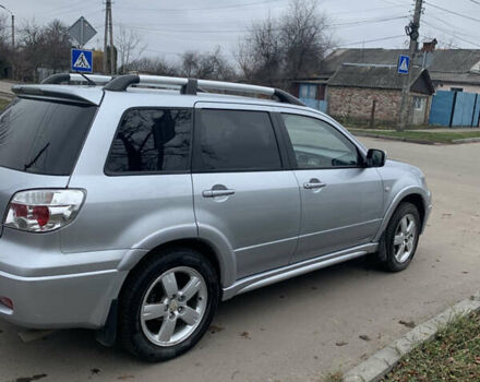 Серый Мицубиси Аутлендер, объемом двигателя 2 л и пробегом 247 тыс. км за 5999 $, фото 2 на Automoto.ua