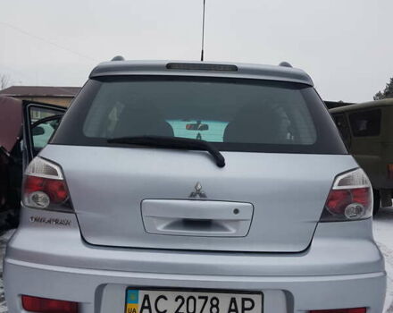 Серый Мицубиси Аутлендер, объемом двигателя 2.38 л и пробегом 700 тыс. км за 7058 $, фото 5 на Automoto.ua