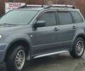 Серый Мицубиси Аутлендер, объемом двигателя 2 л и пробегом 200 тыс. км за 5999 $, фото 1 на Automoto.ua