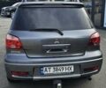 Серый Мицубиси Аутлендер, объемом двигателя 2 л и пробегом 209 тыс. км за 6400 $, фото 3 на Automoto.ua