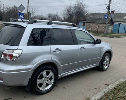 Серый Мицубиси Аутлендер, объемом двигателя 2 л и пробегом 247 тыс. км за 5999 $, фото 2 на Automoto.ua