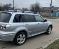 Серый Мицубиси Аутлендер, объемом двигателя 2 л и пробегом 247 тыс. км за 5999 $, фото 2 на Automoto.ua