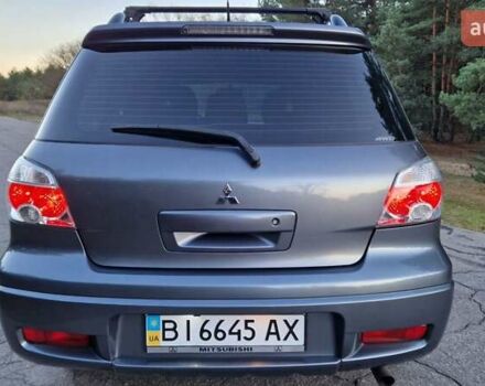 Серый Мицубиси Аутлендер, объемом двигателя 2 л и пробегом 157 тыс. км за 8300 $, фото 1 на Automoto.ua