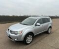 Серый Мицубиси Аутлендер, объемом двигателя 2 л и пробегом 200 тыс. км за 8300 $, фото 2 на Automoto.ua