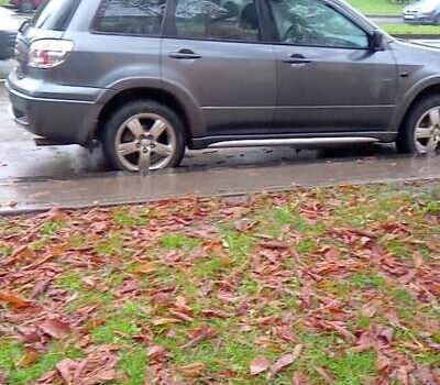 Серый Мицубиси Аутлендер, объемом двигателя 2.38 л и пробегом 117 тыс. км за 7900 $, фото 2 на Automoto.ua