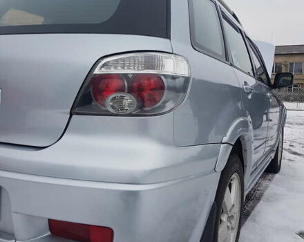 Серый Мицубиси Аутлендер, объемом двигателя 2.38 л и пробегом 700 тыс. км за 7058 $, фото 7 на Automoto.ua