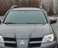 Серый Мицубиси Аутлендер, объемом двигателя 2 л и пробегом 200 тыс. км за 5999 $, фото 2 на Automoto.ua