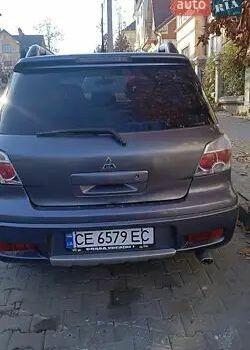Серый Мицубиси Аутлендер, объемом двигателя 2 л и пробегом 176 тыс. км за 5400 $, фото 3 на Automoto.ua