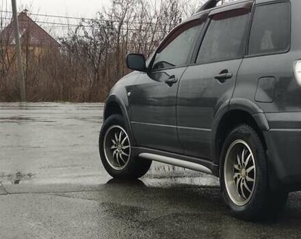 Серый Мицубиси Аутлендер, объемом двигателя 2 л и пробегом 200 тыс. км за 5999 $, фото 5 на Automoto.ua