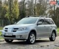 Серый Мицубиси Аутлендер, объемом двигателя 2.38 л и пробегом 170 тыс. км за 6900 $, фото 1 на Automoto.ua