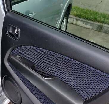 Серый Мицубиси Аутлендер, объемом двигателя 2.38 л и пробегом 323 тыс. км за 6800 $, фото 12 на Automoto.ua