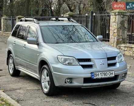 Серый Мицубиси Аутлендер, объемом двигателя 2.38 л и пробегом 170 тыс. км за 6900 $, фото 3 на Automoto.ua