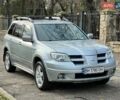Серый Мицубиси Аутлендер, объемом двигателя 2.38 л и пробегом 170 тыс. км за 6900 $, фото 3 на Automoto.ua