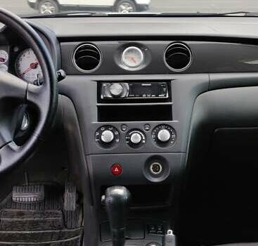 Серый Мицубиси Аутлендер, объемом двигателя 2.38 л и пробегом 323 тыс. км за 6800 $, фото 6 на Automoto.ua