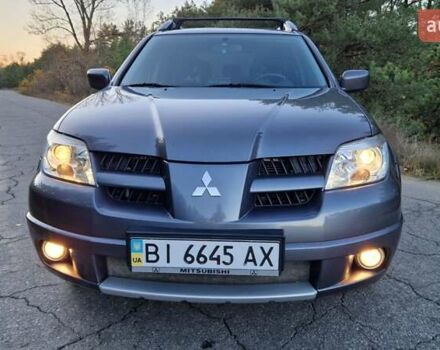 Серый Мицубиси Аутлендер, объемом двигателя 2 л и пробегом 157 тыс. км за 8300 $, фото 5 на Automoto.ua