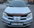 Сірий Міцубісі Аутлендер, об'ємом двигуна 2.4 л та пробігом 190 тис. км за 7500 $, фото 1 на Automoto.ua
