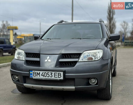 Серый Мицубиси Аутлендер, объемом двигателя 2.38 л и пробегом 254 тыс. км за 7300 $, фото 2 на Automoto.ua