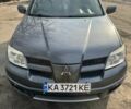Сірий Міцубісі Аутлендер, об'ємом двигуна 2.4 л та пробігом 122 тис. км за 7900 $, фото 1 на Automoto.ua