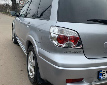 Серый Мицубиси Аутлендер, объемом двигателя 2 л и пробегом 247 тыс. км за 5999 $, фото 6 на Automoto.ua