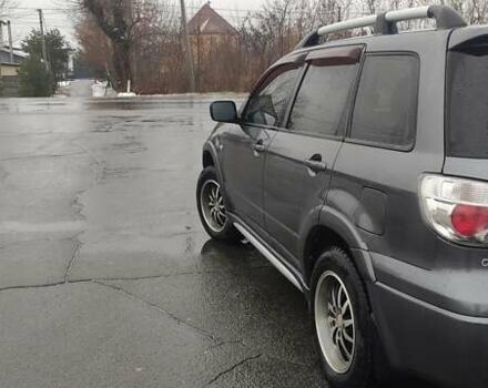 Серый Мицубиси Аутлендер, объемом двигателя 2 л и пробегом 200 тыс. км за 5999 $, фото 9 на Automoto.ua