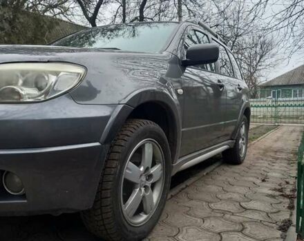 Серый Мицубиси Аутлендер, объемом двигателя 2.38 л и пробегом 143 тыс. км за 7300 $, фото 6 на Automoto.ua