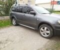 Серый Мицубиси Аутлендер, объемом двигателя 2.38 л и пробегом 160 тыс. км за 8300 $, фото 5 на Automoto.ua
